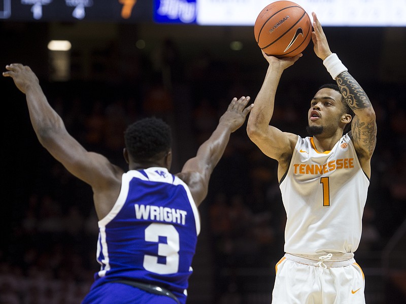 Tennessee guard Lamonte Turner (1) attempts a shot past High Point guard Jamal White (3) during an NCAA college basketball game Tuesday, Nov. 14, 2017, in Knoxville, Tenn.