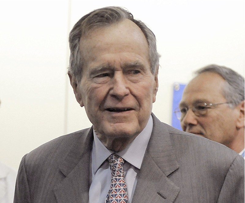 
              FILE - In a Tuesday, Dec. 2, 2008 file photo, former President George H. W. Bush leaves a news conference at the Houston hospital where his wife Barbara has spent a week after surgery for a perforated ulcer. Another woman has stepped forward to accuse former President George H.W. Bush of inappropriately touching her. Roslyn Corrigan told Time magazine that she was 16 when Bush grabbed her buttocks as she posed for a photo with him in 2003 at a gathering of CIA officers north of Houston. (AP Photo/Pat Sullivan, File)
            