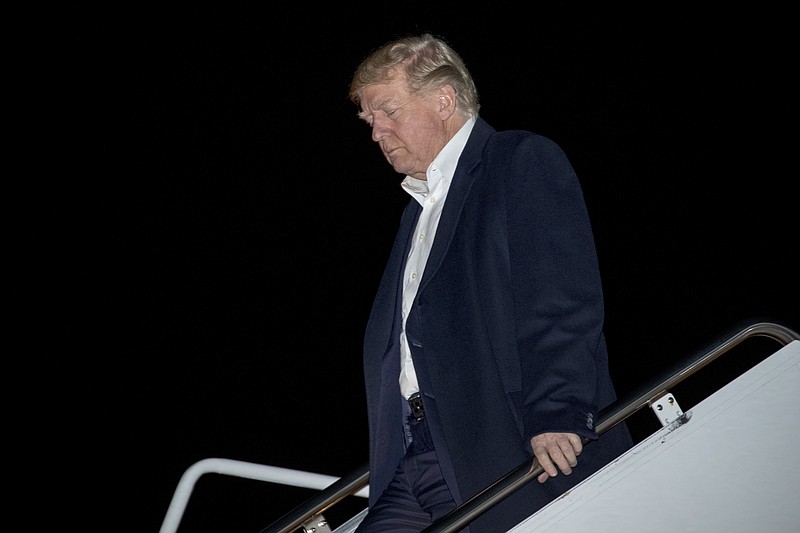 President Donald Trump arrives at Andrews Air Force Base, Md., Tuesday, Nov. 14, 2017, to board Marine One for a short trip to the White House. Trump returns from a five country trip through Asia traveling to Japan, South Korea, China, Vietnam and the Philippines. (AP Photo/Andrew Harnik)