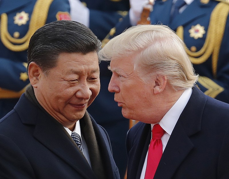 In this Nov. 9, 2017, file photo, U.S. President Donald Trump, right, chats with Chinese President Xi Jinping during a welcome ceremony at the Great Hall of the People in Beijing. Following Trump's visit to Beijing, China says it's sending a high-level special envoy to North Korea amid an extended chill in relations between the neighbors over Pyongyang's nuclear weapons and missile programs. The official Xinhua News Agency said Wednesday, Nov. 15, 2017, that director of the ruling Communist Party's International Liaison Department, Song Tao, would travel to Pyongyang on Friday to report on the party's national congress held in October. (AP Photo/Andy Wong, File)