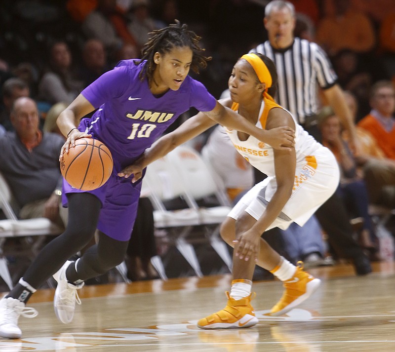 James Madison's Aneah Young (10) drives the ball against Tennessee's Anastasia Hayes during an NCAA college basketball game Wednesday, Nov. 15, 2017 in Knoxville, Tenn. (Daryl Sullivan/The Daily Times via AP)