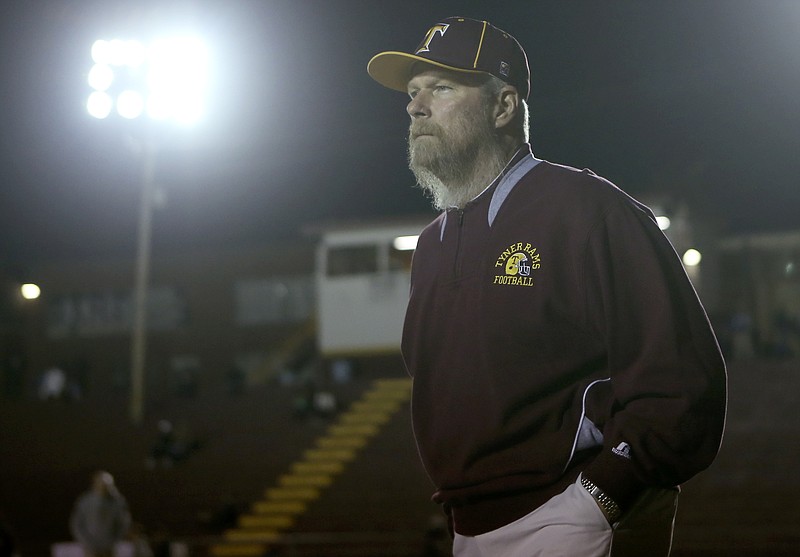 Tyner head coach Wayne Turner looks on as his team warms up at Tyner Academy's Bob Evans Stadium on Friday, Nov. 10, 2017 in Chattanooga, Tenn. The Tyner Rams hosted the Watertown Purple Tigers in the second round of the TSSAA football playoffs.