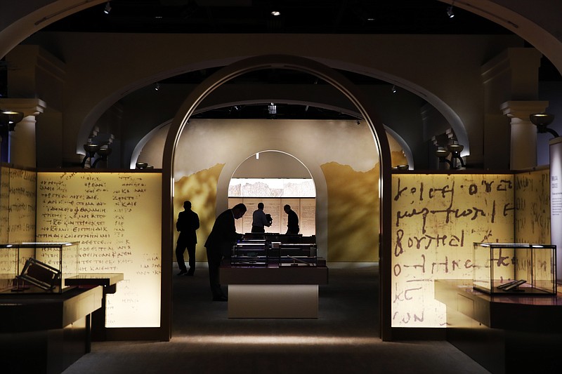 Exhibits are readied inside the Museum of the Bible, Monday, Oct. 30, 2017, in Washington. The project is largely funded by the conservative Christian owners of the Hobby Lobby crafts chain. Hobby Lobby president Steve Green says the aim is to educate not evangelize. But skeptics call the project a Christian ministry disguised as a museum. (AP Photo/Jacquelyn Martin)