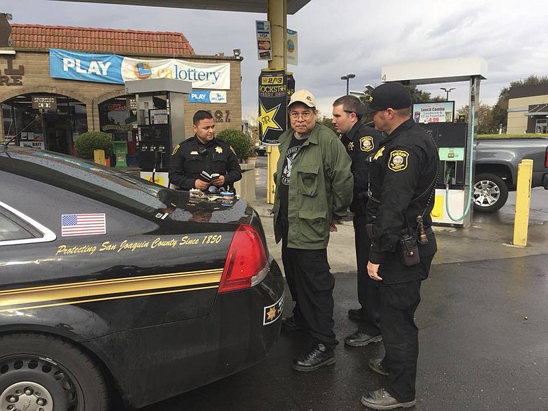 This photo provided by the San Joaquin County Sheriff's office shows Randall Saito being arrested in Stockton, Calif., Wednesday, Nov. 15, 2017. Saito, who escaped from a psychiatric hospital in Hawaii, was captured as the result of a tip from a taxi cab driver. (San Joaquin County Sheriff's Office via AP)