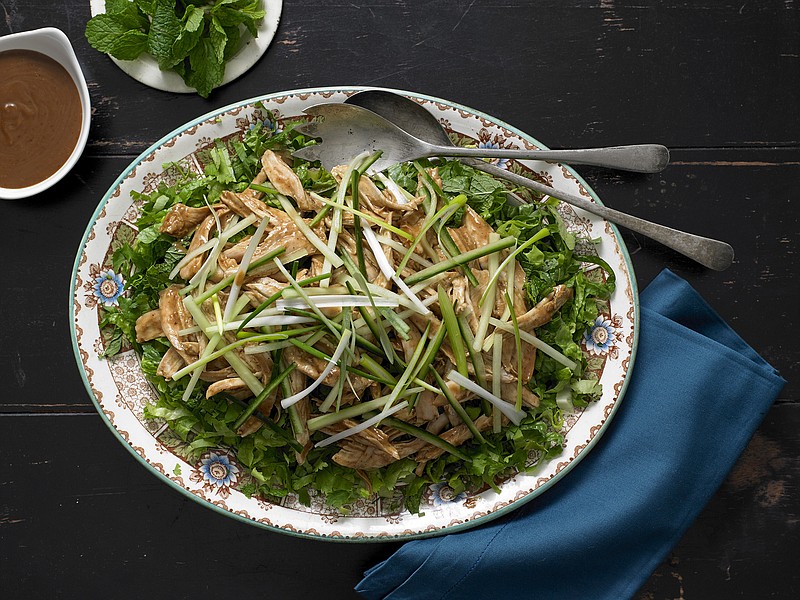 This fast-assembled Bang Bang Turkey Salad is nothing more than shredded turkey under a satay-like sauce of peanut butter, chile bean and Chinese vinegar, with some shredded lettuce and chopped cucumbers.