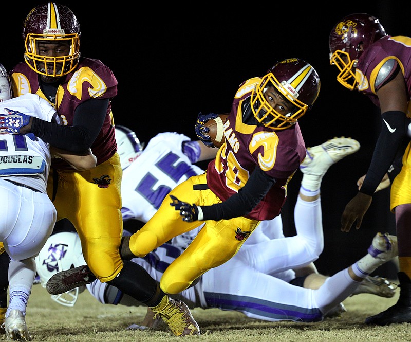 Tyner's Jeremy Elston (20) runs the ball during the Class 2A quarterfinal football game between Tyner and Marion County Friday, Nov. 17, 2017 in Bob Evans Stadium at Tyner High School. 