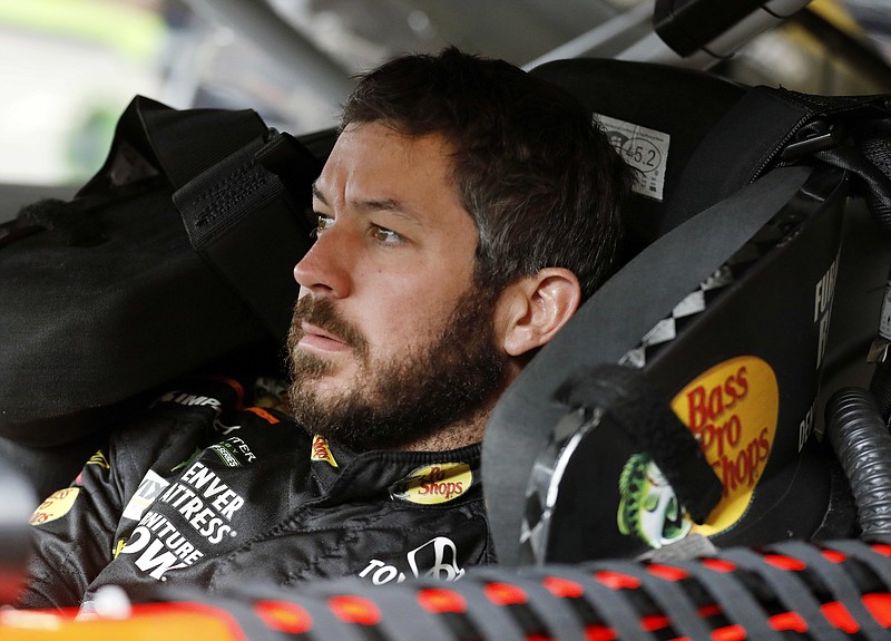 In this Oct. 21, 2017, file photo, Martin Truex Jr. prepares for a practice run for the NASCAR Cup Series auto race at Kansas Speedway in Kansas City, Kan. In the Cup Series, the finale features Martin Truex Jr., Brad Keselowski, Kevin Harvick and Kyle Busch. (AP Photo/Colin E. Braley, File)