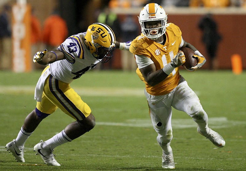 LSU linebacker Ray Thornton (43) goes to tackle Tennessee running back John Kelly (4) during an NCAA football game at Neyland Stadium on Saturday, Nov. 18, 2017 in Knoxville, Tenn.