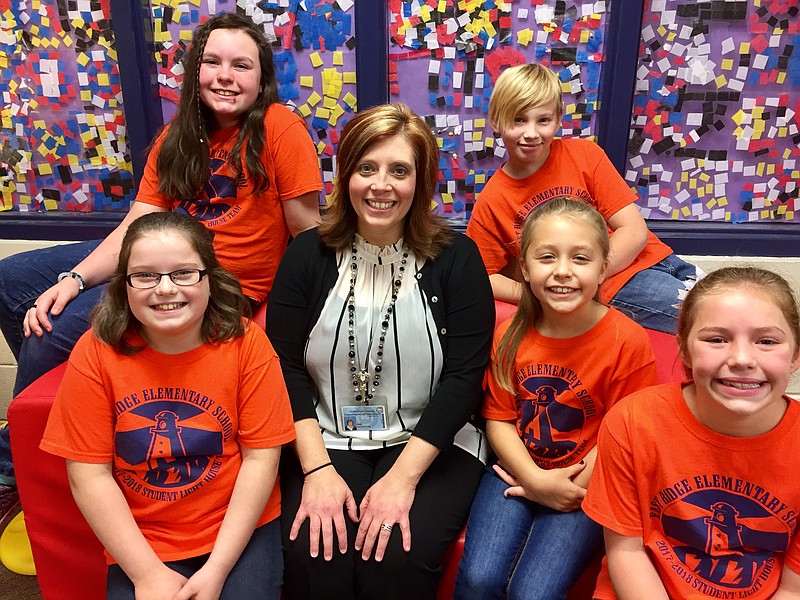 East Ridge Elementary Principal Gail Huffstutler poses with students in the Synergy Station. (Contributed photo)