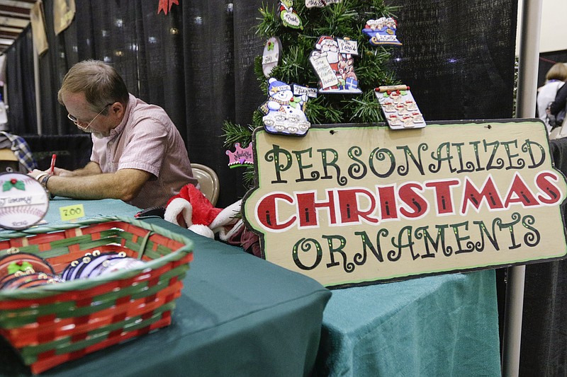 Randy Bullard makes personalized ornaments at the Times Free Press HoHo Expo at the Chattanooga Convention Center on Saturday, Nov. 18, 2017, in Chattanooga, Tenn. The free expo, which features a chance to meet Santa as well as holiday shopping vendors, continues Sunday from 11:00 a.m. to 5:00 p.m.