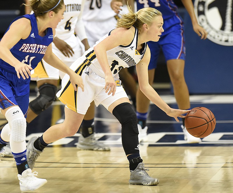 UTC's Lakelyn Bouldin (33) gathers in a Presbyterian turnover.  The Presbyterian Blue Hose visited the Chattanooga Mocs in women's basketball action in McKenzie Arena on November 18, 2017.  