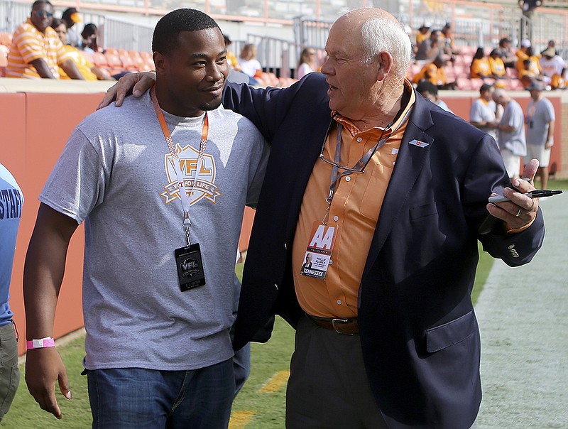 Former Tennessee Vols football coach Phillip Fulmer, right, chats with former wide receiver C.J. Fayton at Neyland Stadium before the South Carolina game last month.