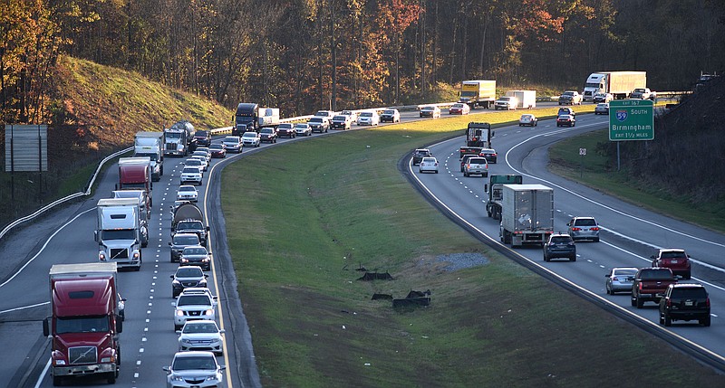 The last light of day catches some of the eastbound traffic along Interstate 24 near Wildwood, Georgia on November 17, 2017.  AAA reduces that 50.9 million Americans will travel over the Thanksgiving Holiday, a 3.3 percent increase over 2016. 