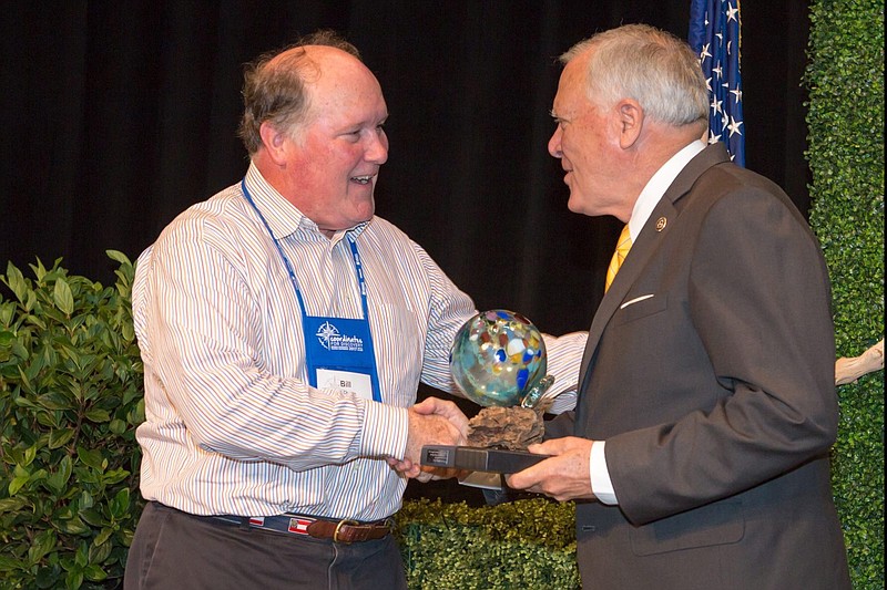 Bill Chapin, left, chief executive at See Rock City Inc., received the Tom Kilgore Lifetime Achievement Award from Georgia Gov. Nathan Deal.