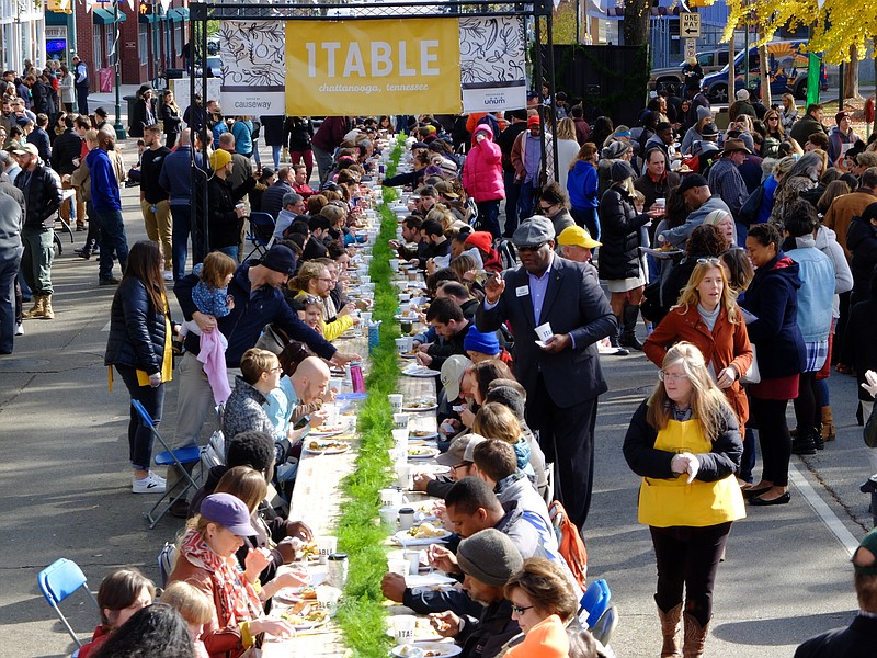 Hundreds eat Monday, Nov. 20, during Causeway's annual citywide Thanksgiving dinner, called 1TABLE. This year the event moved two blocks east on M.L. King Boulevard in front of the Bessie Smith Cultural Center.