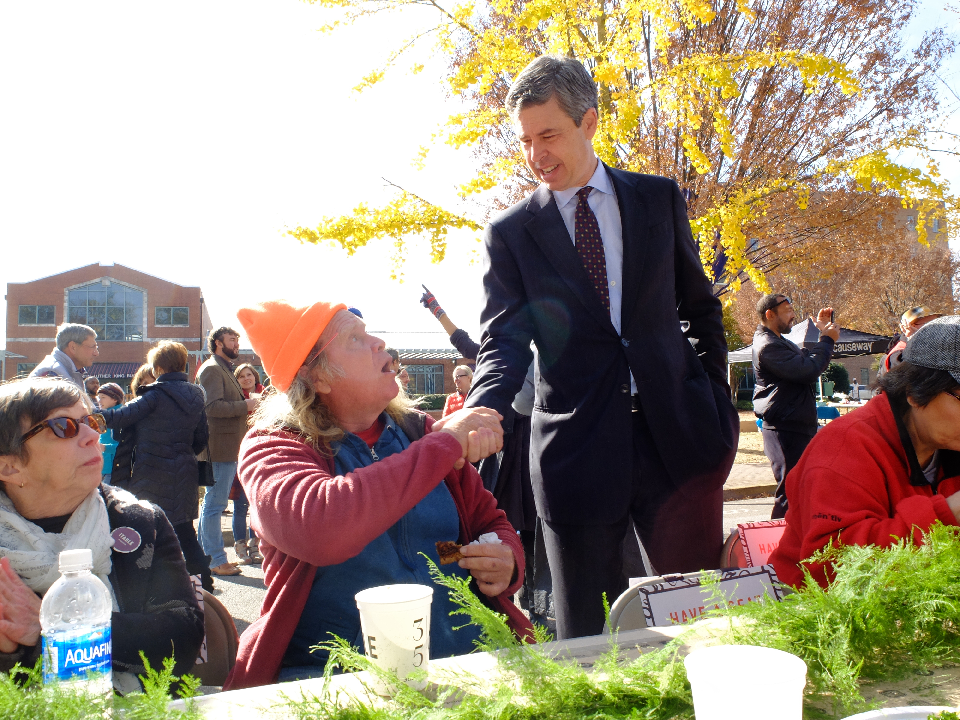 Chattanooga Mayor Andy Berke shakes the hand of Ron Grayson, 64, during 1TABLE, Causeway's annual citywide Thanksgiving dinner.