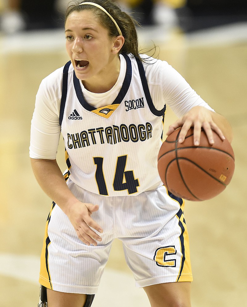 UTC's Molly Melton (14) sets the offense.  The Presbyterian Blue Hose visited the Chattanooga Mocs in women's basketball action in McKenzie Arena on November 18, 2017.  