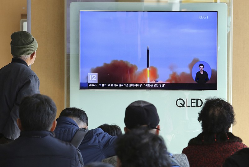 People watch a TV screen showing file footage of North Korea's missile launch at Seoul Railway Station in Seoul, South Korea, Tuesday, Nov. 21, 2017. U.S. President Donald Trump announced Monday the U.S. is putting North Korea's "murderous regime" on America's terrorism blacklist, despite questions about Pyongyang's support for international attacks beyond the assassination of its leader's half brother in February. (AP Photo/Ahn Young-joon)