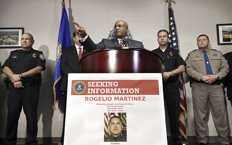 FBI Special Agent in Charge of the El Paso field office Emmerson Buie Jr. speaks during a press conference at the FBI field office, Tuesday, Nov. 21, 2017, in El Paso, Texas, about the death of a border patrol agent and the severe injuries of a second agent. FBI officials said Tuesday that officers are investigating the incident as a "potential physical assault" on federal officers, but said there are several scenarios that might have led to the agents' injuries. (Mark Lambie/The El Paso Times via AP)
