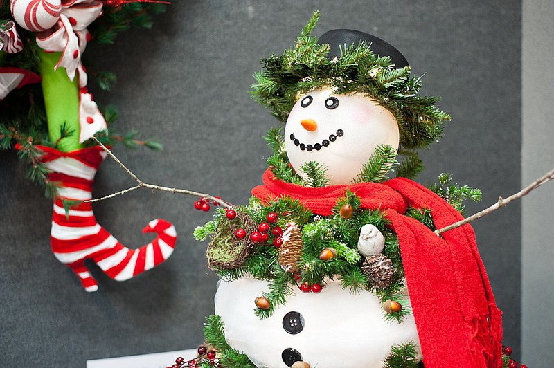 A snowman is festooned with greenery in the Harris Arts Center's Festival of Trees. (Contributed Photo)