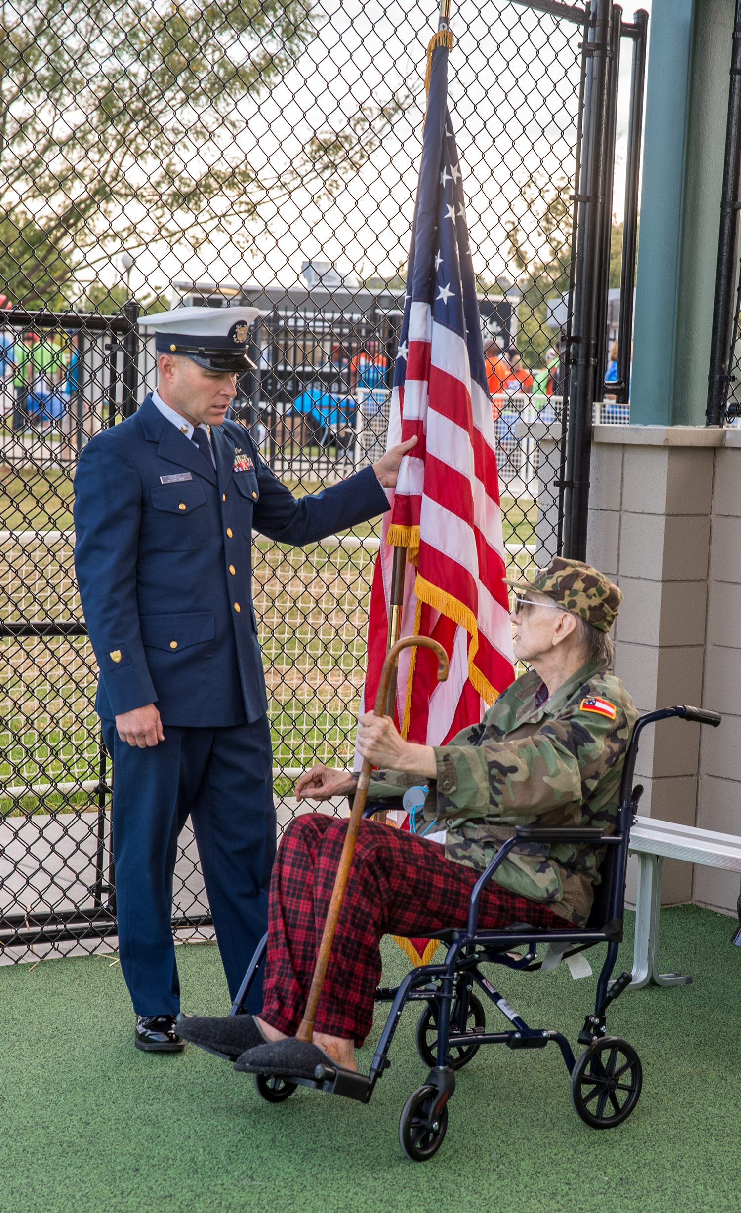 U.S. Coast Guard First Class Petty Officer Josh McNeill talks with Army veteran Bob Pruvenok.