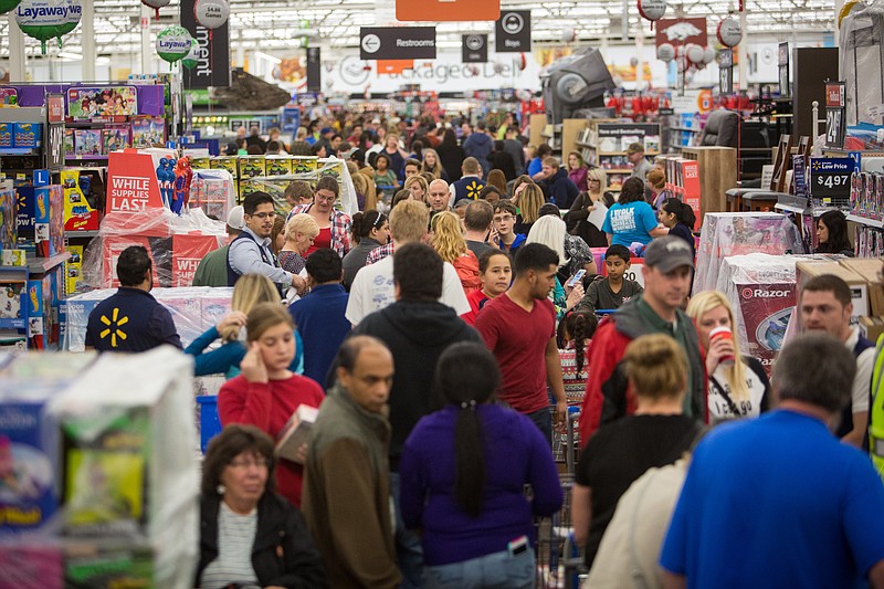 IMAGE DISTRIBUTED FOR WALMART -Customers save big at Walmart's Black Friday shopping event on Thursday, Nov. 26, 2015 in Rogers, Ark. Hundreds of customers at Walmart stores across the country took advantage of deals on top items, like televisions, video game consoles, and toys. Easy shopping continues in Walmart stores and on Walmart.com through the holidays. (Photo by Gunnar Rathbun/Invision for Walmart/AP Images)