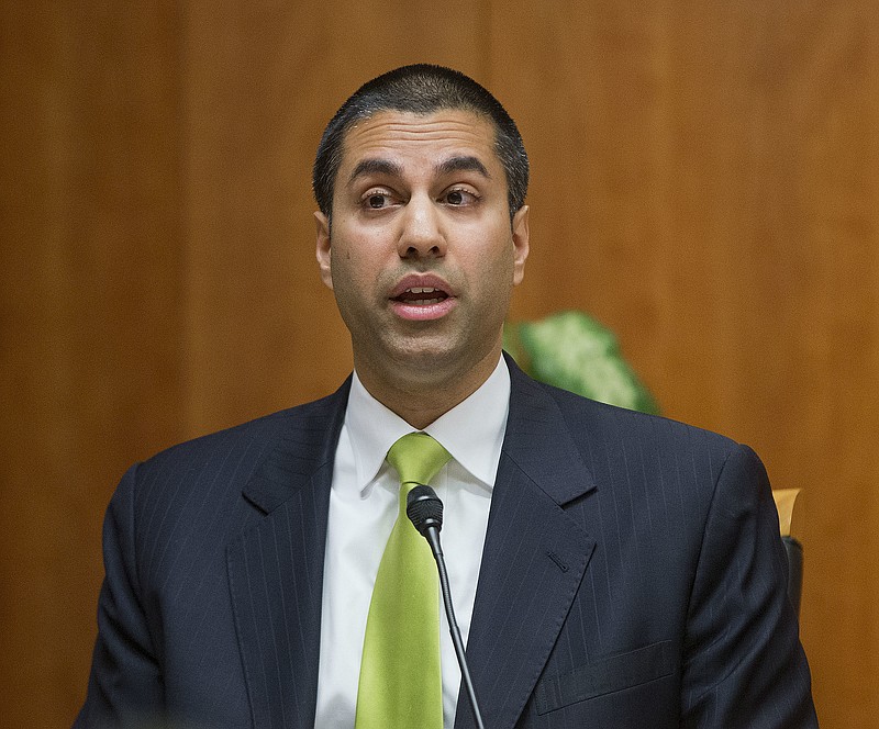 In this Feb. 26, 2015, file photo, Federal Communication Commission Commissioner Ajit Pai speaks during an open hearing and vote on "Net Neutrality" in Washington. Federal Communications Commission Chairman Ajit Pai is following through on his pledge to repeal 2015 regulations designed to ensure that internet service providers treat all online content and apps equally. Pai distributed his alternative plan to the net neutrality rules to other FCC commissioners Tuesday, Nov. 21, 2017, in preparation for a Dec. 14 vote on the proposal. (AP Photo/Pablo Martinez Monsivais, File)