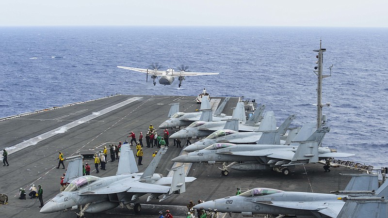 A C-2A Greyhound assigned to Fleet Logistics Support Squadron (VRC) 30 launches from the flight deck of the aircraft carrier USS Ronald Reagan (CVN 76) on Nov. 17, 2017. (Mass Communication Specialist 3rd Class Eduardo Otero/U.S. Navy via AP)