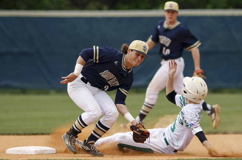 Soddy-Daisy shortstop Justin Cooke makes a catch just shy of Rhea County runner Cameron Travis as he steals 2nd during their prep baseball game at Soddy-Daisy High School on Thursday, April 21, 2016, in Soddy-Daisy, Tenn.