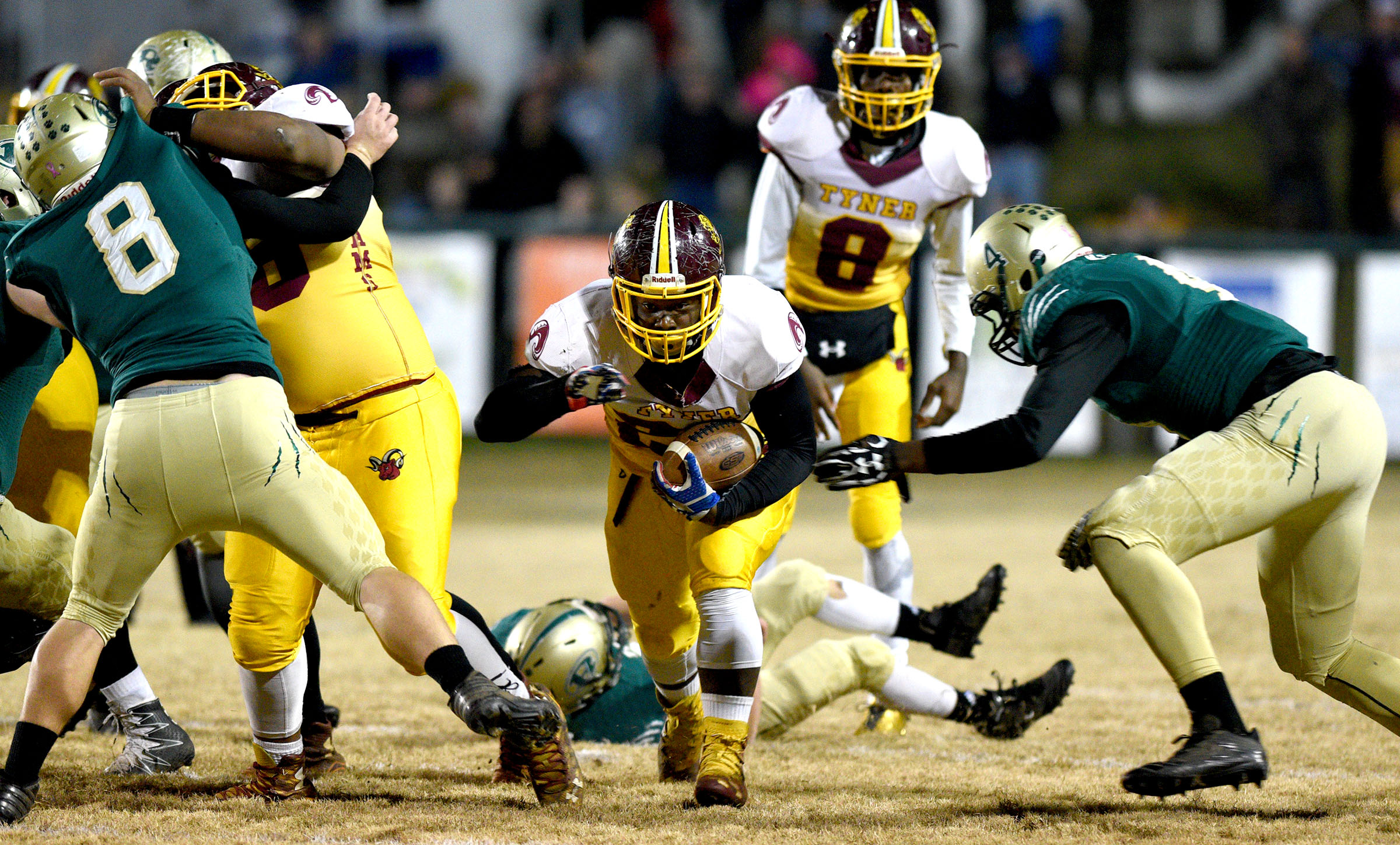 Tyner's Tyon Young (27) runs through a hole in the Tiger defense. The Tyner Rams visited the Rockwood Tigers in the semi-finals of the TSSAA Class AA Championship on November 24, 2017.