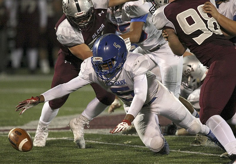 Red Bank's Calvin Jackson (5) dives after his fumble during the TSSAA Class 3A semifinals against Alcoa at Alcoa High School's Goddard Field on Friday, Nov. 24, 2017 in Alcoa, Tenn. Alcoa would recover the ball.