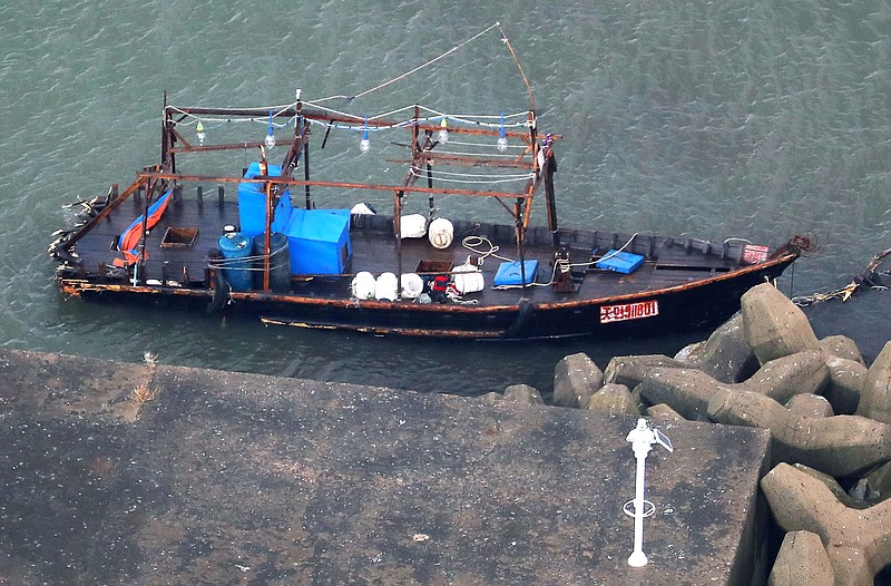 
              A wooden boat is moored at a nearby marina, in Yurihonjo, Akita prefecture, northern Japan, Friday, Nov. 24, 2017.   Japanese police are investigating eight men found on Japan's northern coast who say they are from North Korea and washed ashore after their boat broke down.  Akita prefectural police said Friday they found the men late Thursday after receiving a call that a group of suspicious men were standing around at the seaside in Yurihonjo town.  Police also found the wooden boat at the marina. (Kyodo News via AP)
            