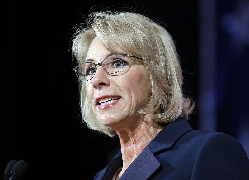 In this Oct. 13, 2017, file photo, Education Secretary Betsy DeVos speaks during a dinner hosted by the Washington Policy Center in Bellevue, Wash. The Education Department wants to narrow the scope of civil rights investigations at schools, focusing on individual complaints rather than systemic problems, according to a document obtained by The Associated Press. (AP Photo/Ted S. Warren, File)