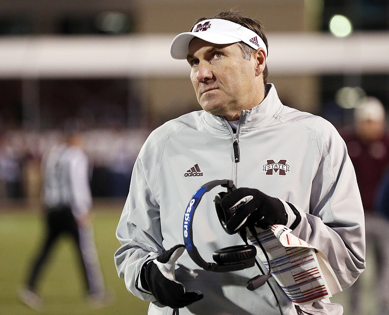 Mississippi State coach Dan Mullen gives the scoreboard a glance in the closing seconds of the team's 31-28 loss to Mississippi in an NCAA college football game in Starkville, Miss., Thursday, Nov. 23, 2017. (AP Photo/Rogelio V. Solis)