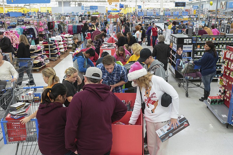 Shoppers at Walmart take advantage of Black Friday deals in Idaho Falls, Idaho on Friday, Nov. 24, 2017. (John Roark/The Idaho Post-Register via AP)