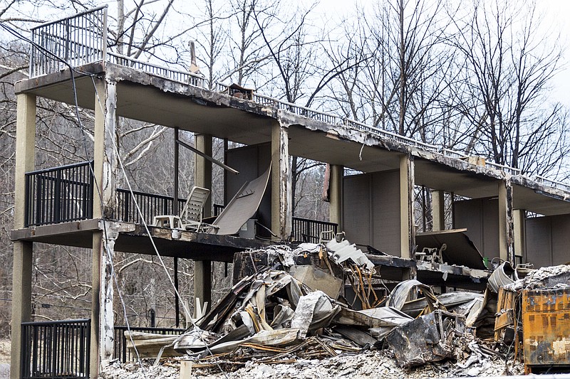 The balconies of a burned-out resort are seen in a heavily damaged neighborhood in Gatlinburg, Tenn., on Friday, Dec. 9, 2016. The resort town reopened to the public for the first time since wildfires on Nov. 28. (AP Photo/Erik Schelzig)