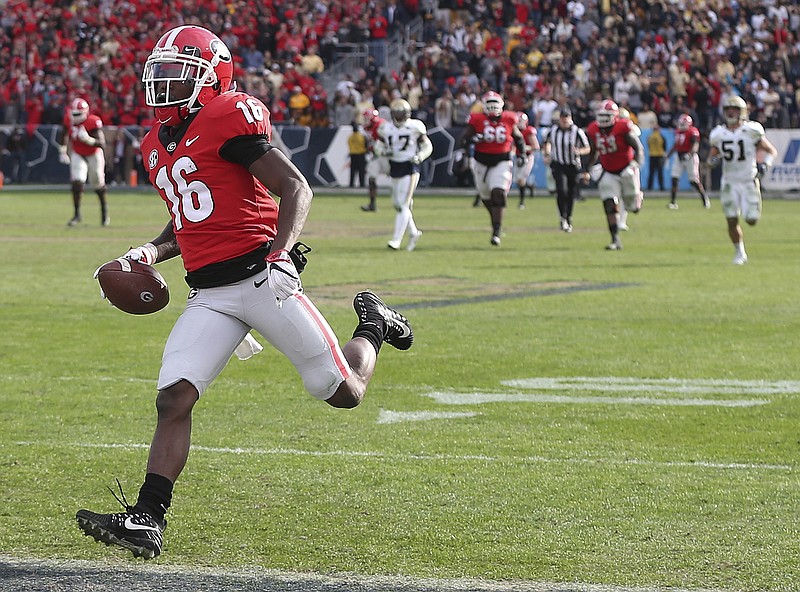 Georgia wide receiver Ahkil Crumpton (16) runs into the end zone for a long touchdown against Georgia Tech during the second half Saturday in Atlanta. Georgia won 38-7.