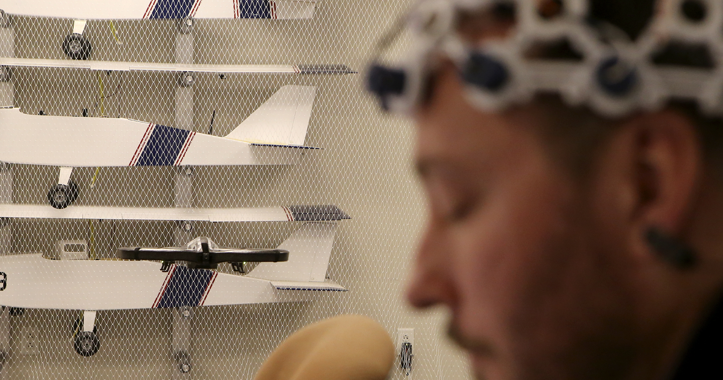 UTC senior Tony Ferguson, an electrical engineering major, launches a drone using his brain in the SimCenter on the campus of the University of Tennessee at Chattanooga on Tuesday, Nov. 21, 2017 in Chattanooga, Tenn. Sixteen sensors, reading different parts of the brain, detect electrical impulses in the user to trigger commands for the drone.