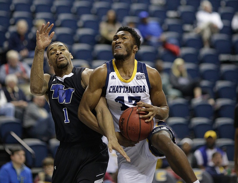 UTC forward A.J. Bowers (13) rebounds against Tennessee Wesleyan guard Andre Applewhite (1) during the Mocs home basketball game against Tennessee Wesleyan at McKenzie Arena on Saturday, Nov. 25, 2017, in Chattanooga, Tenn.