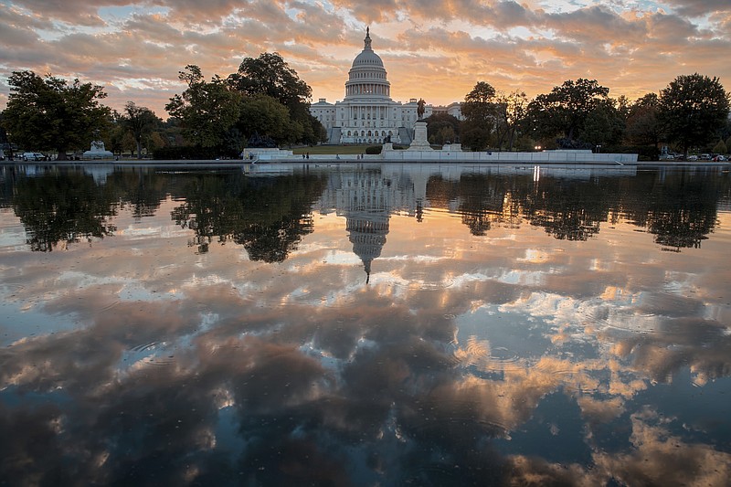 FILE - In this Oct. 10, 2017, file photo, the Capitol is seen at sunrise in Washington. 