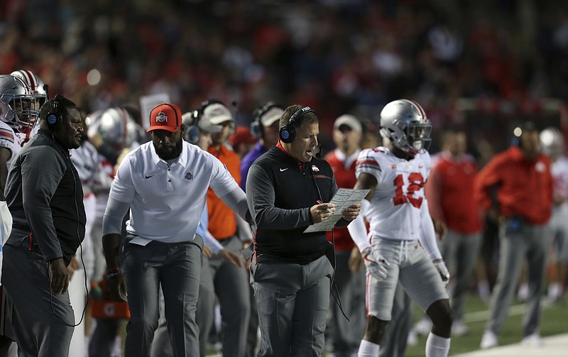 Former head coach of Rutgers football and head coach of the National Football League's Tampa Bay Buccaneers, now Ohio State associate head coach/ defensive coordinator Greg Schiano stands on the sidelines during an NCAA college football game against Rutgers Saturday, Sept. 30, 2017, in Piscataway, N.J. (AP Photo/Mel Evans)