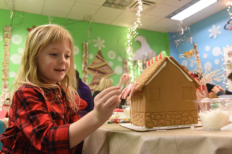 Raylee Freeman, 6, of Soddy-Daisy, applies her candy cane decoration to her gingerbread house Sunday at the Creative Discovery Museum. The sweet tradition returned this year for the annual gingerbread workshop with five remaining dates-Dec. 2, Dec. 9, Dec. 10, Dec. 16 and Dec. 17. Reservations are required. The fee is $25 for members, and $45 non-members.
The Creative Discovery Museum is located at 321 Chestnut St., in downtown Chattanooga.