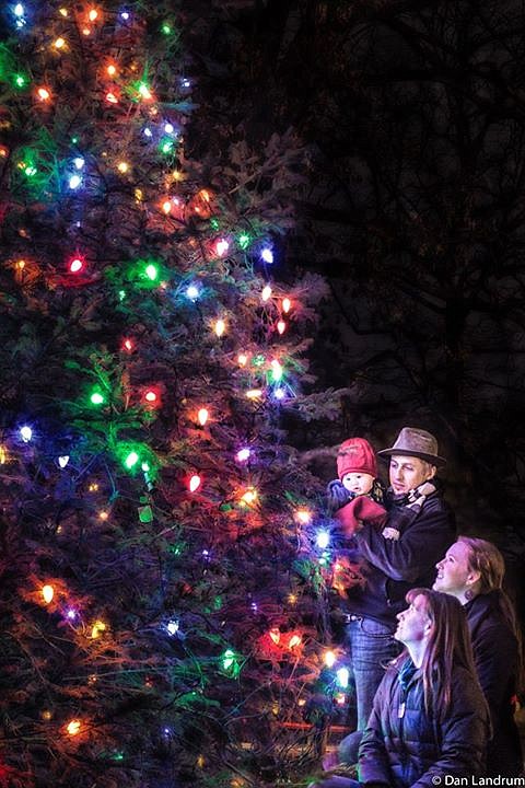 Attendees at a previous Signal Mountain town tree-lighting ceremony at the Mountain Arts Community Center look on as the lights are flipped on for the season. (Contributed photo by Dan Landrum)