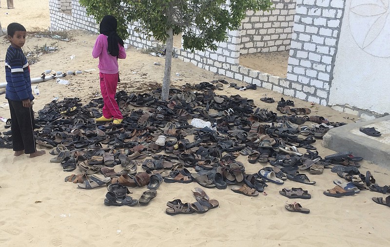 Discarded shoes of victims remain outside Al-Rawda Mosque in Bir al-Abd northern Sinai, Egypt. a day after attackers killed hundreds of worshippers, on Saturday, Nov. 25, 2017. Friday's assault was Egypt's deadliest attack by Islamic extremists in the country's modern history, a grim milestone in a long-running fight against an insurgency led by a local affiliate of the Islamic State group.(AP Photo)