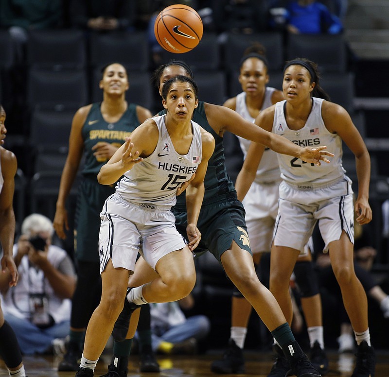 Connecticut's Gabby Williams (15) chases after a loose ball in the second half of an NCAA college basketball game against Michigan State during the Phil Knight Invitational tournament in Eugene, Ore., Saturday, Nov. 25, 2017. (AP Photo/Timothy J. Gonzalez)