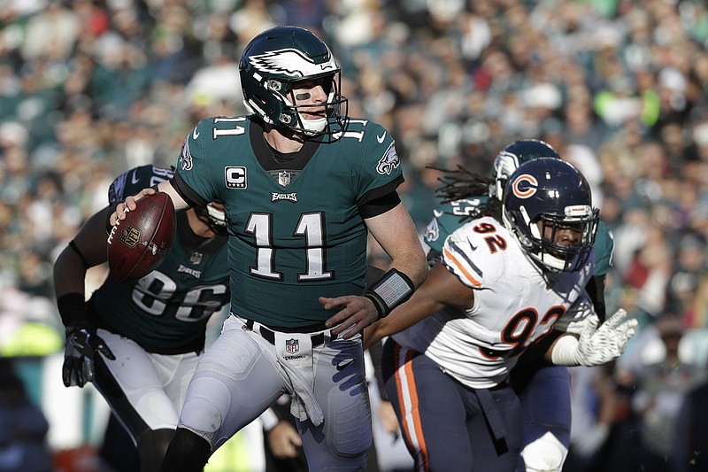 Philadelphia Eagles' Carson Wentz looks to pass during the first half of an NFL football game against the Chicago Bears, Sunday, Nov. 26, 2017, in Philadelphia. (AP Photo/Michael Perez)