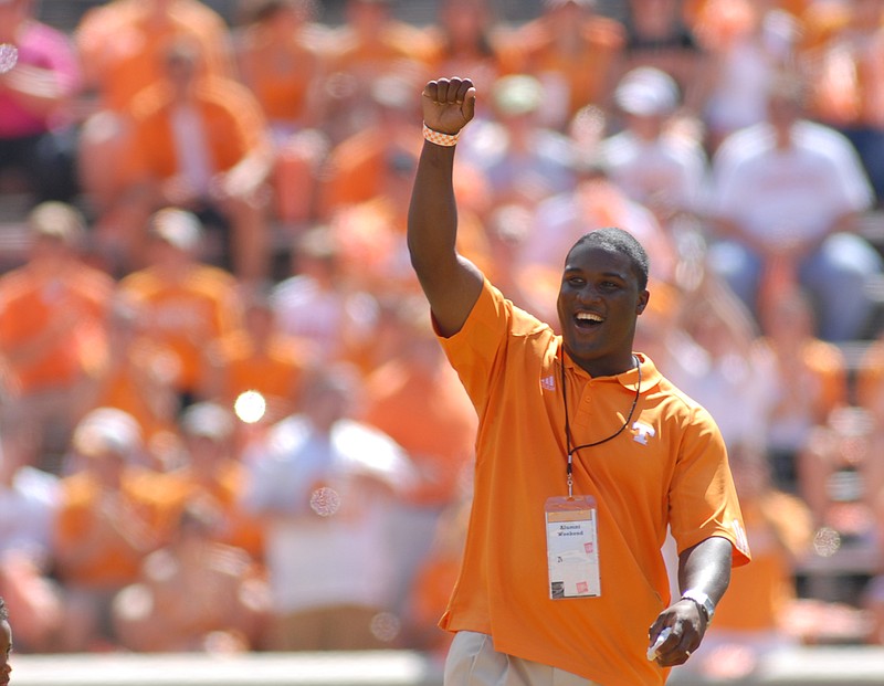 In this 2008 staff file photo, former UT quarterback Tee Martin waves to the crowd while being honored before the the game against UAB at Neyland Stadium.