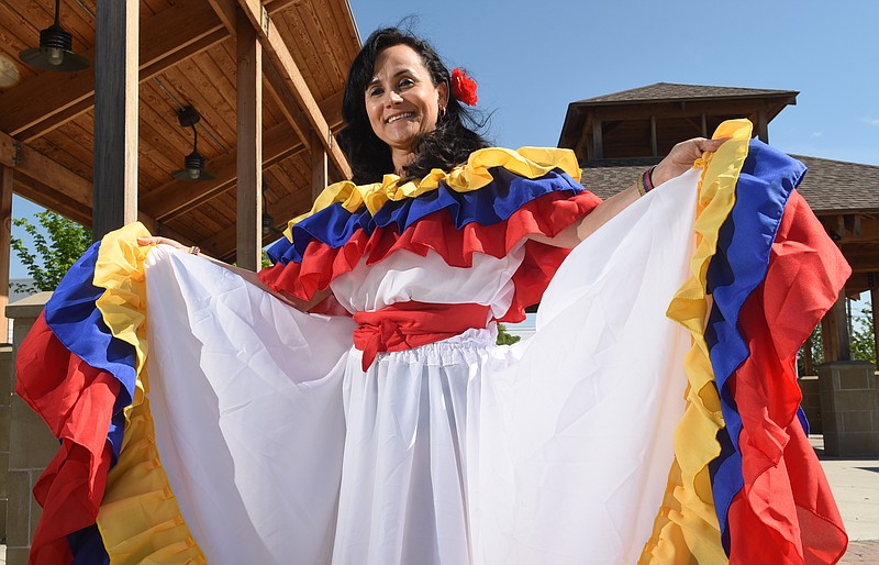 Gladys Pineda-Loher, director of international community outreach at Chattanooga State Community College, models traditional Columbian attire at the Highland Park Commons on Tuesday, Apr. 28,  2015, in Chattanooga, Tenn. The Commons, located in the 2000 block of Union Avenue, will be the site of the city's first Latin Festival on Saturday. 