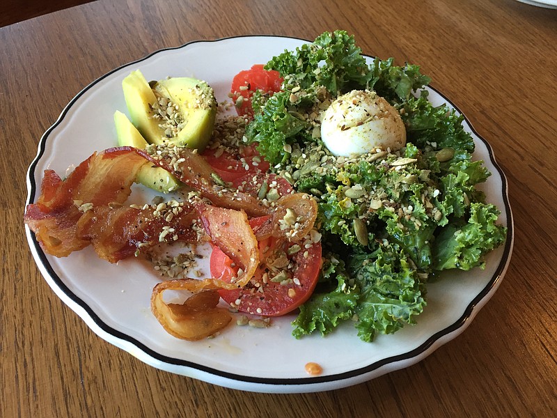 The Paleo Breakfast is a large serving of kale tossed with a tangy Dijon vinaigrette, with a soft- or hard-boiled egg, tomato, half an avocado and a couple of slices of thick-cut bacon on the side. It's sprinkled with pumpkin seeds and dukkah, an Egyptian spice blend made in-house.
