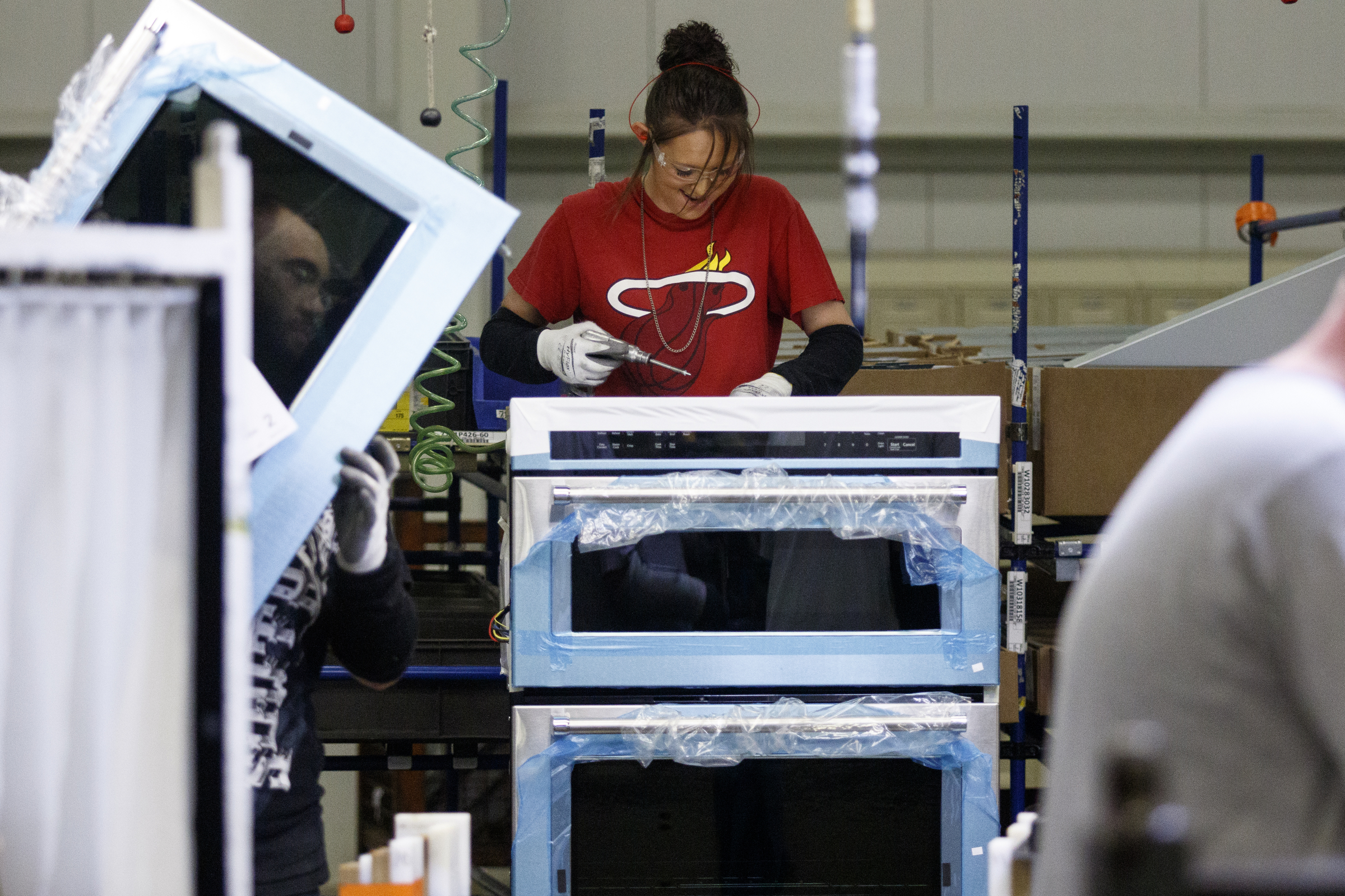 Workers assemble appliances at the Whirlpool manufacturing plant on Thursday, Oct. 6, 2016, in Cleveland, Tenn. The plant gave tours of its facility for National Manufacturing Week.